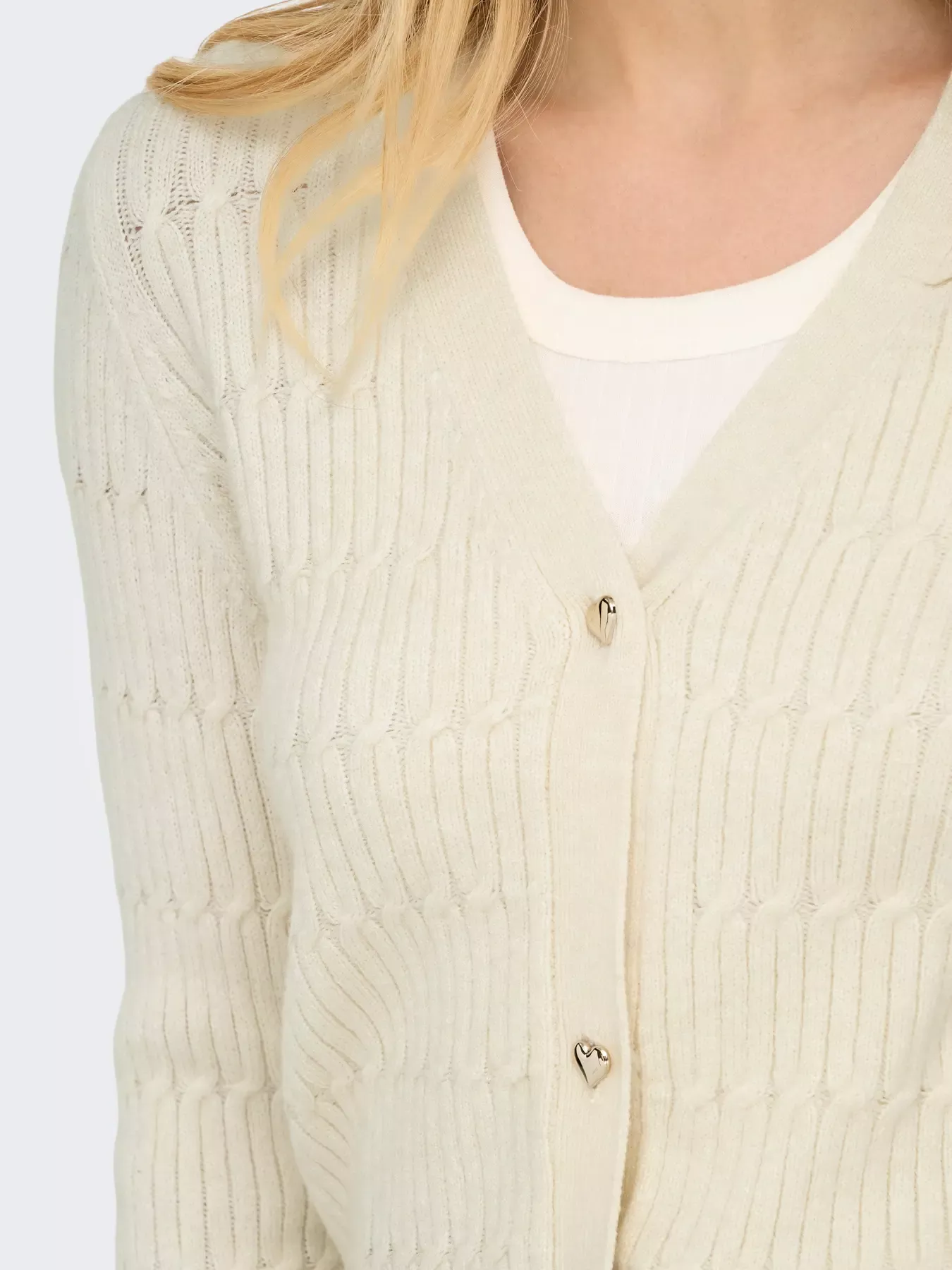 GILET EN MAILLE À COL EN V ET TORSADES